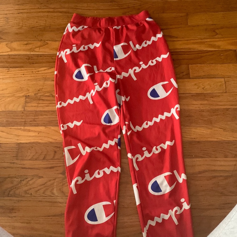 Red Champion Pants with white Champion logo.